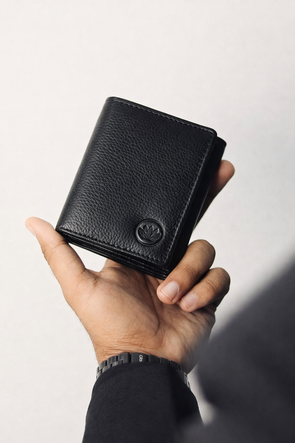 Elegant black leather wallet and hand